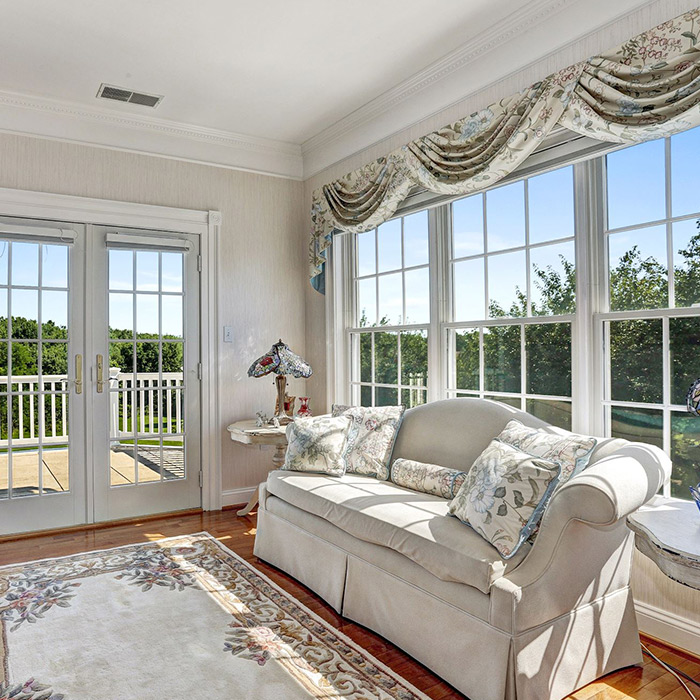 residential property sitting room with large windows and wooden floor upper malboro md